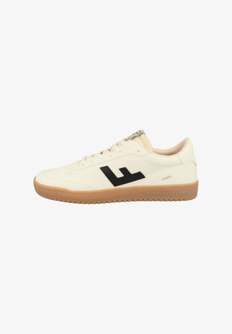 White sneaker with black logo, featuring a smooth leather upper, lace-up design, and a tan rubber outsole with textured pattern.