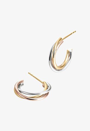 Pendientes de aro retorcidos en metal de tres tonos; cuentan con secciones de plata, oro y oro rosa con un acabado pulido y un cierre seguro.