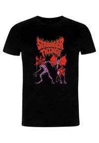 Czarny bawełniany t-shirt z czerwono-różowymi grafikami postaci z "Stranger Things" oraz wyrazistym logo nad ilustracją.