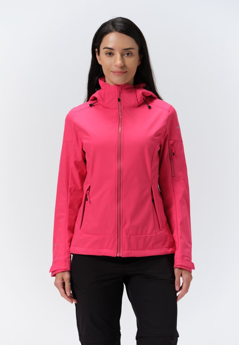 Pink softshell jacket with a zippered front, adjustable hood, and side pockets. Features a smooth texture and fitted design.