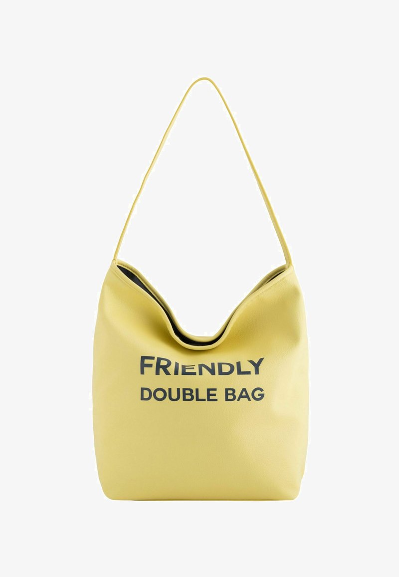 Yellow double bag with a smooth texture, featuring a wide opening and the text "FRIENDLY DOUBLE BAG" in bold black lettering.