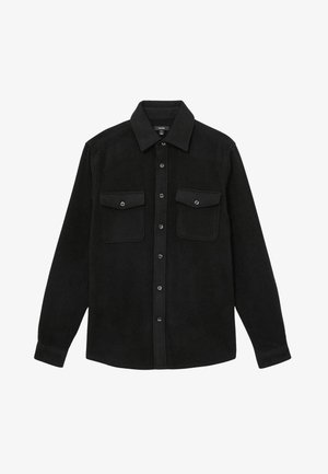 Black flannel shirt featuring a button-up design, two chest pockets, and a classic collar. Smooth texture with plain fabric and no patterns.