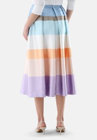 Pleated A-line skirt in lustrous fabric with horizontal stripes in pastel colors: blue, white, orange, and lavender. Knee-length, lightweight design.