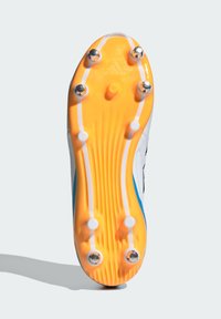 Football boot sole featuring a bright yellow base, six studs, white and blue accents, textured grip lines, and an embossed logo.