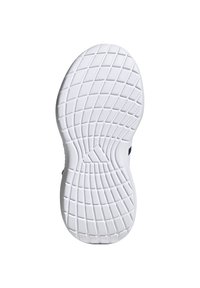 White rubber shoe sole with a textured pattern for grip, featuring a wavy design and distinct tread lines for traction.