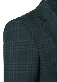 Zielono-granatowa marynarka w kratę o teksturowanej tkaninie i wyraźnych ramionach, z ostrymi klapami i subtelnymi detalami splotu.