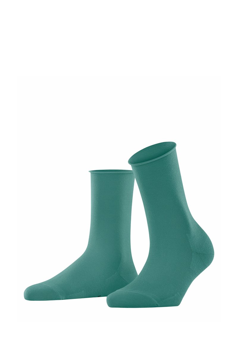 Chaussettes vertes jusqu'à la cheville en matériau lisse et extensible, avec un poignet côtelé et une pointe sans couture pour plus de confort et d'ajustement.