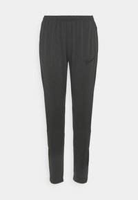 Zwarte sportbroeken van lichtgewicht materiaal, met een elastische tailleband, taps toelopende benen en een klein zwart Nike-logo aan de linkerkant.