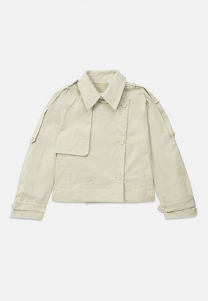 Light beige double-breasted jacket featuring a structured collar, button accents, and epaulets on the shoulders, made from smooth fabric.
