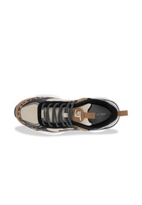 Sneaker featuring a beige mesh upper, black accents, woven laces, and tan detailing on the toe, with a thick white sole.