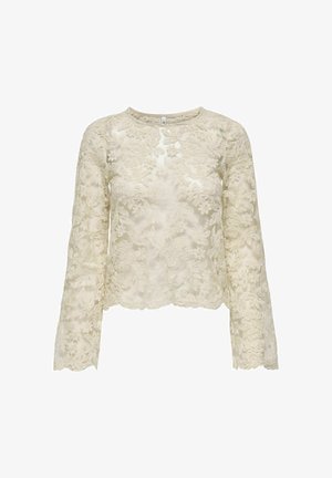 Blonde blonde bluse med lange ærmer i lys beige med blomsterbroderi, rund halsudskæring og bølget kant. Halv-gennemsigtig tekstur.