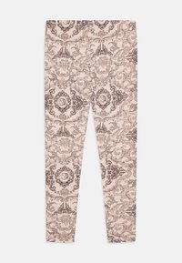 Leggings en tissu rose clair avec un motif damassé brun foncé complexe, ornés de détails et d'accents ovales. 