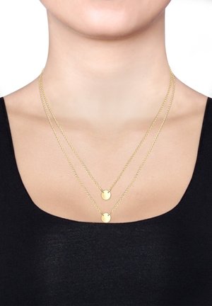 Goldfarbene, mehrlagige Halsketten mit feinen Ketten und runden Anhängern. Einfaches Design in glänzender Ausführung, geeignet für legere oder formelle Anlässe.