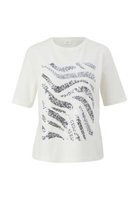 T-shirt blanc avec un motif en sequins zigzag noirs et argentés. Manches courtes et encolure ronde avec une texture lisse.