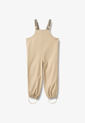 Beige vandtætte overalls med justerbare, stribede seler, elastiske ærmekanter og trykknapdetaljer. Glat tekstur, fuld længde, praktisk design.