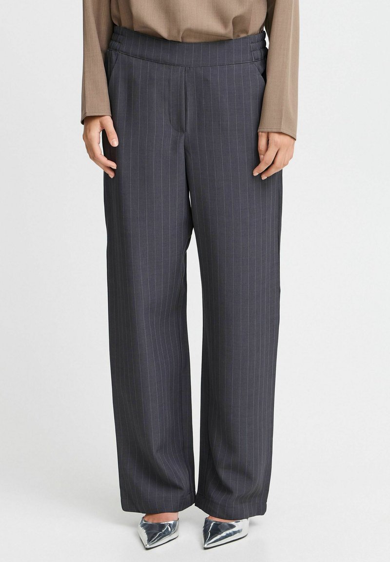 Wide-leg trousers in dark gray with thin vertical stripes. Made of smooth fabric. Features an elasticated waistband for comfort.