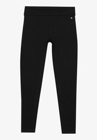 Leggings negre cu talie înaltă. Fabricate dintr-un material neted, elastic, cu cusături plate și un mic accent de logo aproape de talie.