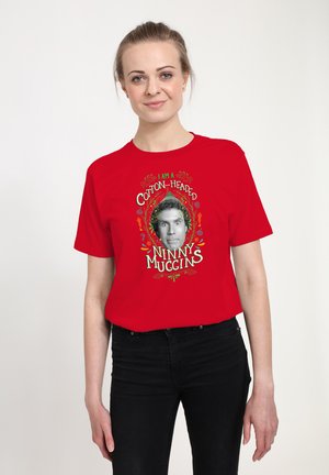 Red cotton t-shirt featuring a graphic design with the text "I AM A COTTON-HEADED NINNY MUGGINS" and a central black-and-white face illustration.