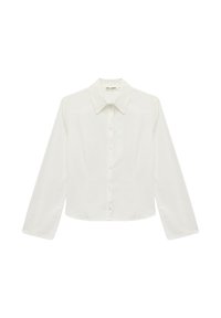 White long-sleeve button-up shirt made of crisp cotton. Features a classic pointed collar and straight cut with a slight waist fit.