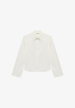 White long-sleeve button-up shirt made of crisp cotton. Features a classic pointed collar and straight cut with a slight waist fit.