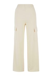 Pantalon cargo beige à jambes larges avec une ceinture élastique et deux poches latérales. Confectionné dans un tissu doux et lisse avec une coupe décontractée.