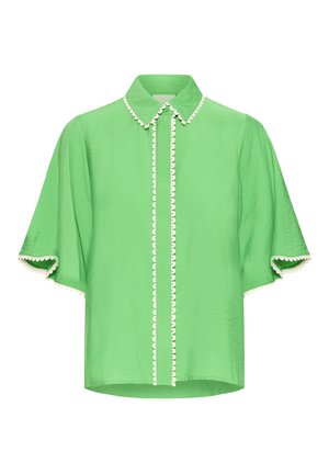 Svetlozelená blúzka s krátkymi rukávmi, špicatým golierom a bielym vlnkovým lemovaním pozdĺž zapínania na gombíky, goliera a okrajov rukávov.