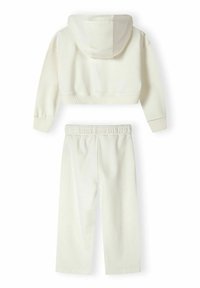 Light cream cropped hoodie with a drawstring hood and long sleeves, paired with matching loose-fit sweatpants featuring an elastic waistband.