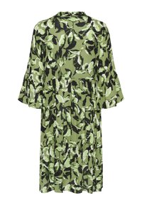 Grünes knielanges Kleid mit abstraktem Blattmuster in Schwarz und Weiß und dreiviertellangen Glockenärmeln, von hinten gezeigt.