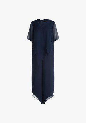 Robe bleu marine avec des manches courtes en voile, un design superposé et un col en V. L'ourlet présente une coupe légèrement asymétrique. Fermeture éclair au dos.