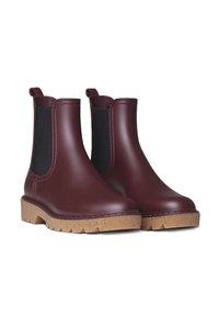 Botas de goma burdeos hasta el tobillo con paneles laterales elásticos negros y una suela texturizada color canela. Presentan un diseño robusto y tiradores para facilitar el calzado.