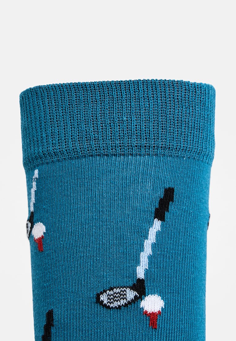 Türkise Socke mit geripptem Saum, verziert mit einem Muster aus schwarzen und weißen Golfschlägern. Das weiche Material und die glatte Textur sorgen für Komfort.