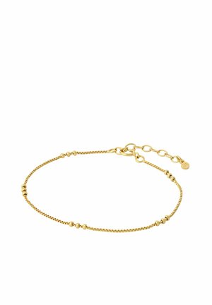 Delikati auksinė grandinėlės apyrankė su mažais tarpikliais ir reguliuojamu užsegimu ant balto fono.