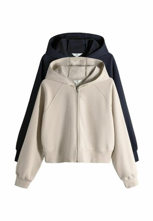 To mellemstore hættetrøjer med lynlås, en beige foran og en sort bagved, vist på en hvid baggrund.