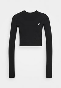 Schwarzes, langärmliges Sportoberteil mit einem verkürzten Design, das aus strukturierten Stoffabschnitten besteht und ein kleines Markenlogo auf der Brust trägt.