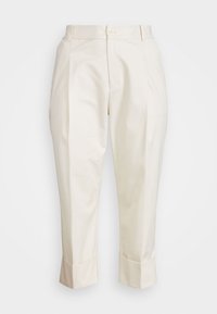 Kermavärvi kohandatud püksid ees olevate voltidega, pööratud ääred, küljetaskud ja nööbiga kinnitamine vöökoht.