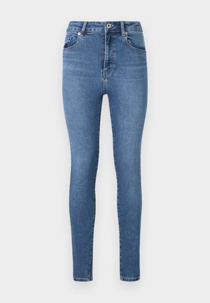Jeans skinny em denim azul médio, com cintura alta, design de cinco bolsos e detalhes de costura subtil nos bolsos e nas costuras.