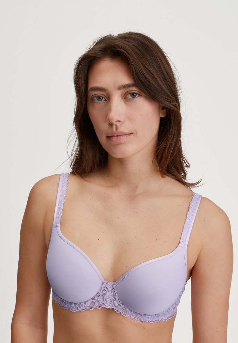 Lilac padded bra with lace accents at the band and straps. Smooth texture and underwire design, featuring adjustable straps.