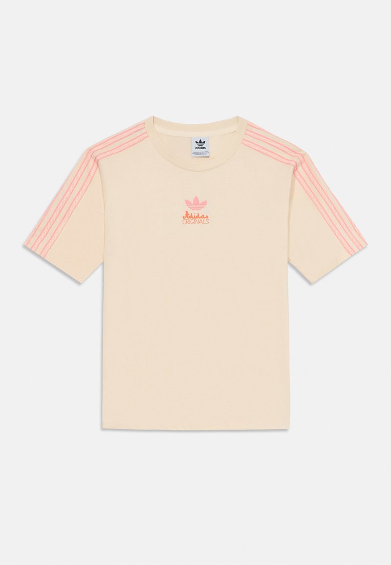 Cream-colored cotton t-shirt with short sleeves, featuring pink three-stripe accents and an embroidered pink Adidas logo on the chest.
