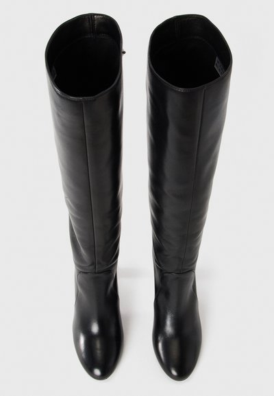 Pair of tall, black leather boots with rounded toes, standing upright on a plain white background.