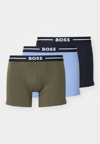 Three pairs of boxers in olive green, light blue, and dark navy. Each features a black waistband with white "BOSS" branding. Cotton blend material.