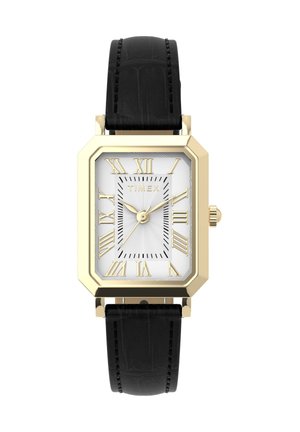 Ορθογώνιο ρολόι Timex με χρυσό τόνο, λευκό καντράν, χρυστούς ρωμαϊκούς αριθμούς, τρεις χρυσές δείκτες και μαύρο δερμάτινο λουράκι με ραφές.