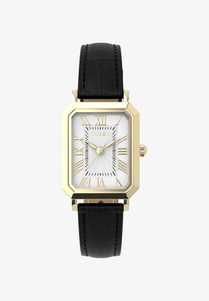 Taisnstūrveida zelta krāsas Timex pulkstenis ar baltu ciparnīcu, zelta romiešu cipariem, trim zelta rādītājiem un melnu ādas siksniņu ar šuvēm.