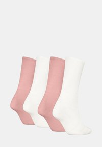 Set di quattro calzini: due di colore rosa chiaro e due bianchi. Tessitura a coste, lunghezza fino al polpaccio, finitura liscia e punta senza cuciture.