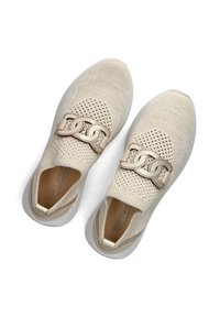 Beige knitted slip-on shoes with a chain accent, textured upper, and lightweight white sole. Interior features a soft lining.