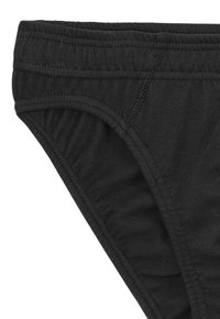 Schwarze Baumwollunterhose mit einem weichen, elastischen Bund, glatter Textur und genähten Details entlang der Kanten und Seiten.