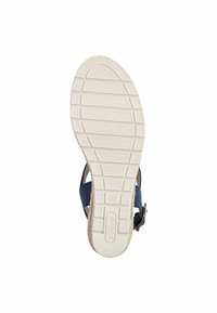 Sandale navy avec une semelle en caoutchouc texturé, dotée d'une sangle cheville ajustable et d'une semelle intérieure de couleur claire. Design minimaliste sans motifs visibles.