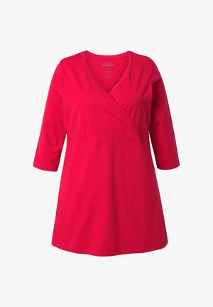 Červená bavlněná tunika ve stylu zavinování s výstřihem do V a tříčtvrtečními rukávy. Má přiléhavý živůtek a rozšířený spodní díl. Jemná textura.