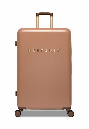 Hard-shell suitcase in matte rose gold with gold embossed "SUITSUIT" logo, a retractable brown handle, and four spinner wheels.