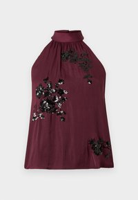 Μπορντό τοπ με τιράντες, κατασκευασμένο από απαλό ύφασμα, διακοσμημένο με μαύρη κεντητική με λουλούδια και παγιέτες κατ�ά μήκος του μπροστινού μέρους, και με στρογγυλεμένο λαιμόκοψη.