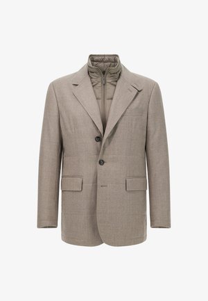 Bruine wolmix blazer met ingeeyerdbare revers, twee steekzakken aan de voorkant en een contrasterende gewatteerde voering. Voorzien van twee zwarte knopen aan de voorkant.